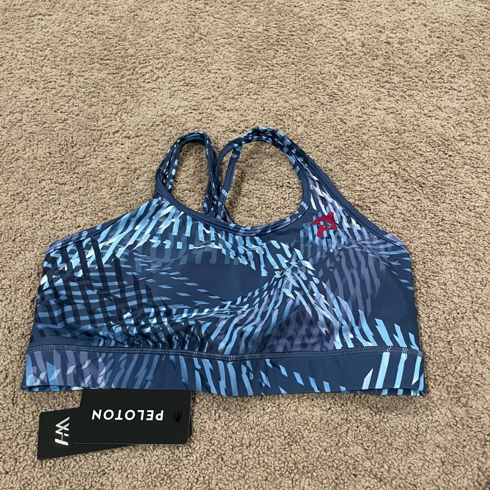 Peloton x WITH brand bra. NWT in bag. Bra pads included.